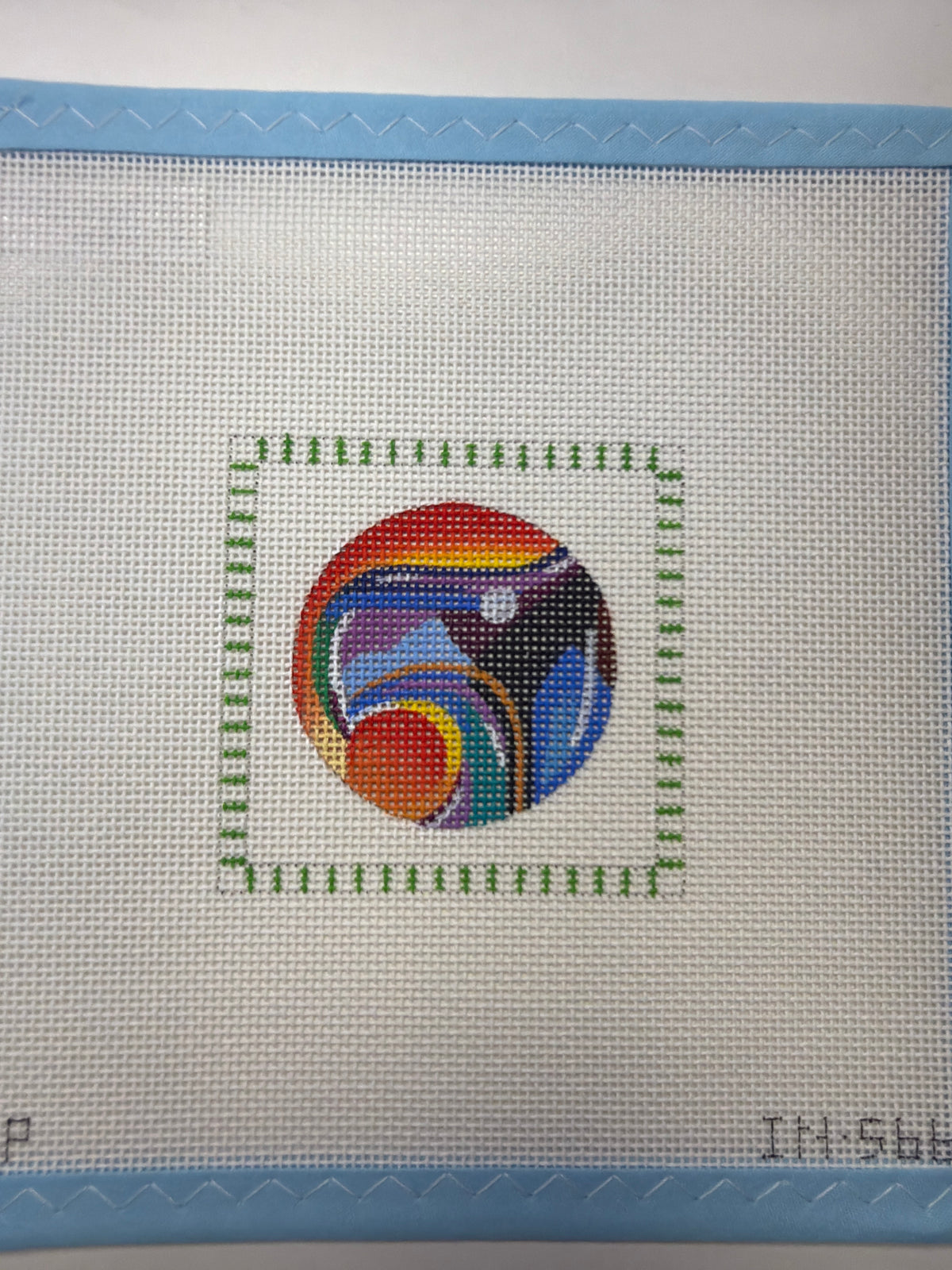 Rectangular needlepoint wall art with colorful marble pattern
