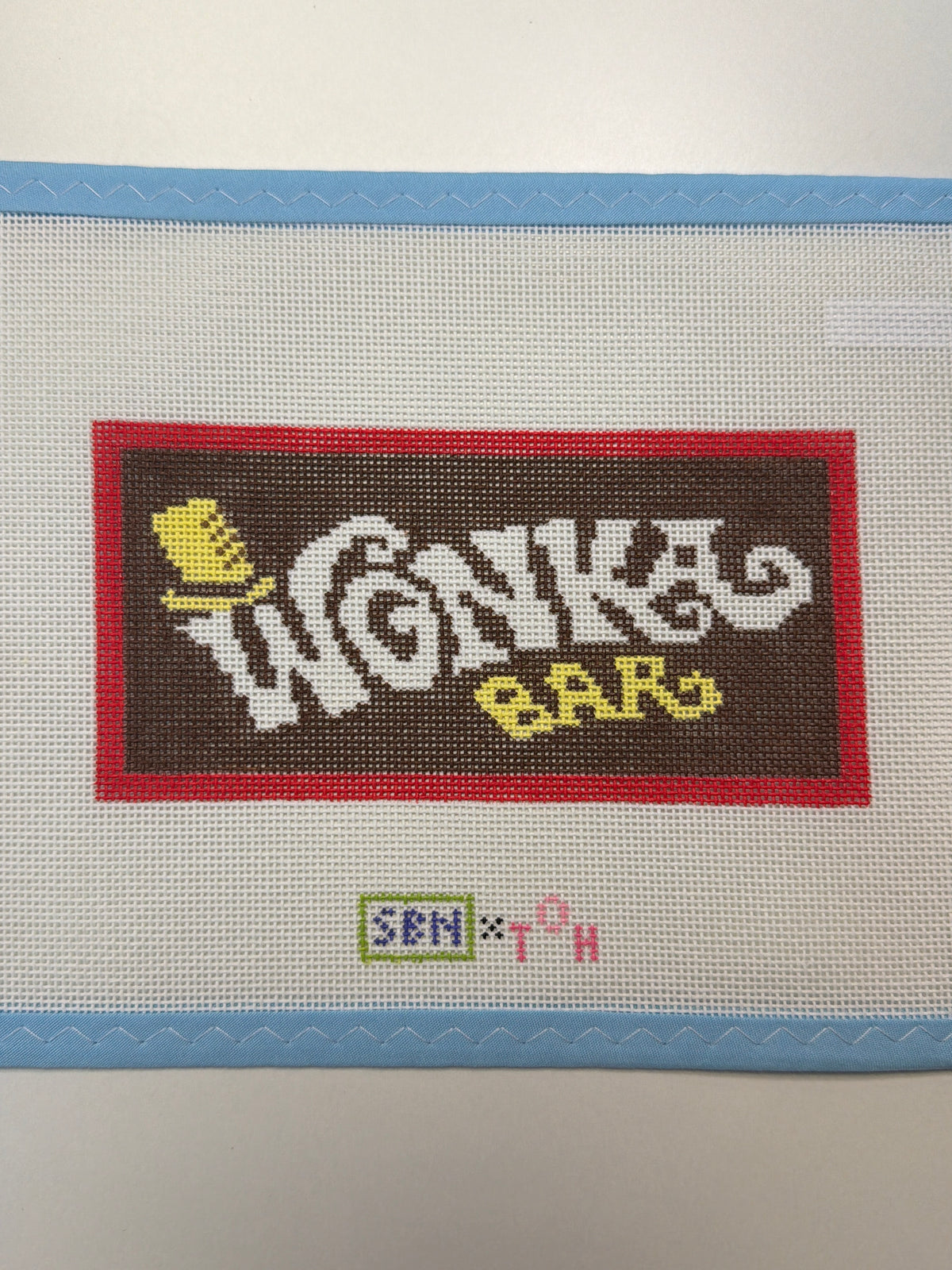 Wonka Bar logo fabric patch with red border and colorful cartoon typography