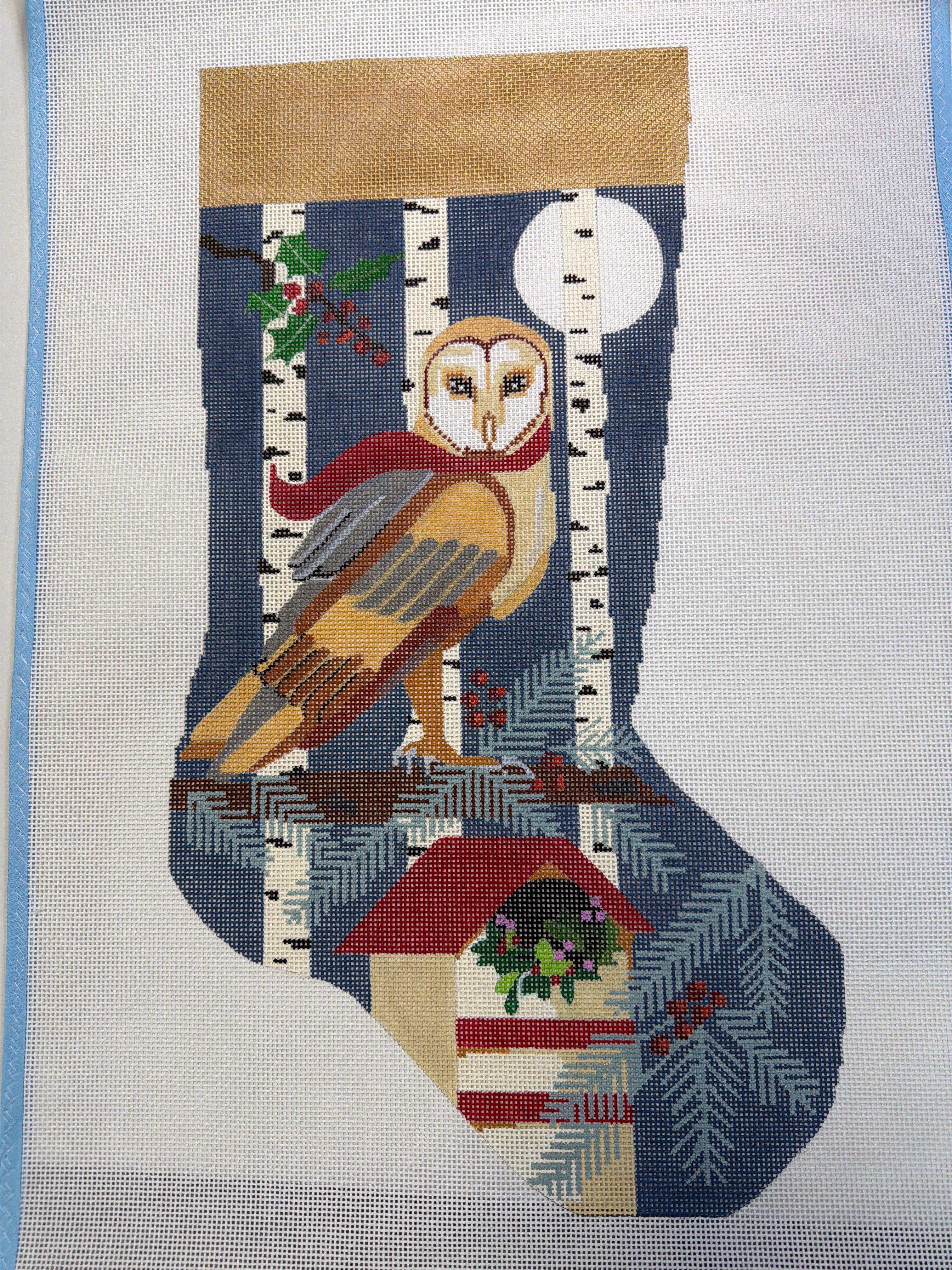 Owl-themed knitted Christmas stocking with colorful owl and ornament pattern