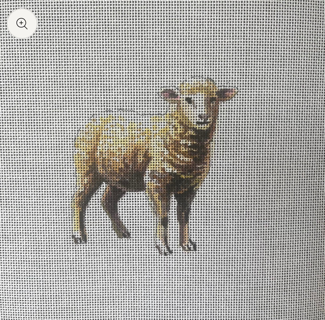 Brown and white lamb figurine standing