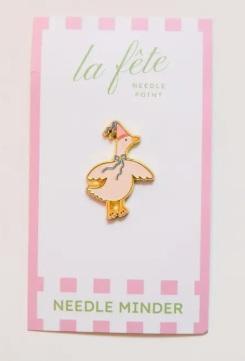 Enamel needle minder pin with a gold and pink dancing goose