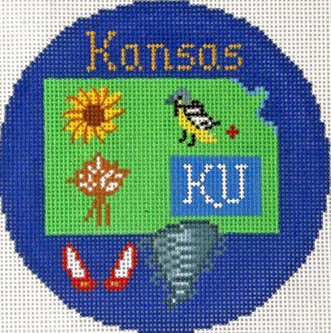 Blue circular needlework Kansas ornament with green panel and “Kattles” lettering