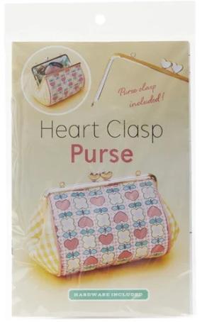 Heart clasp purse with colorful heart pattern, zip top, and wrist strap