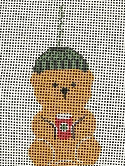 Bear-shaped cup with green cap, orange body, red face patch, and white eye detail