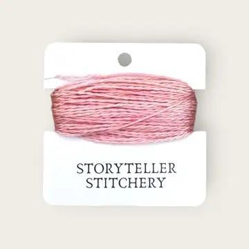 Hand-dyed embroidery thread spool, pink and light gray variegated.