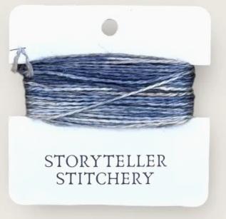 Hand-dyed embroidery thread skein on card, dark blue with subtle heathering