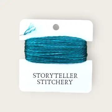 Hand-dyed embroidery thread spool, turquoise and teal blue variegated.