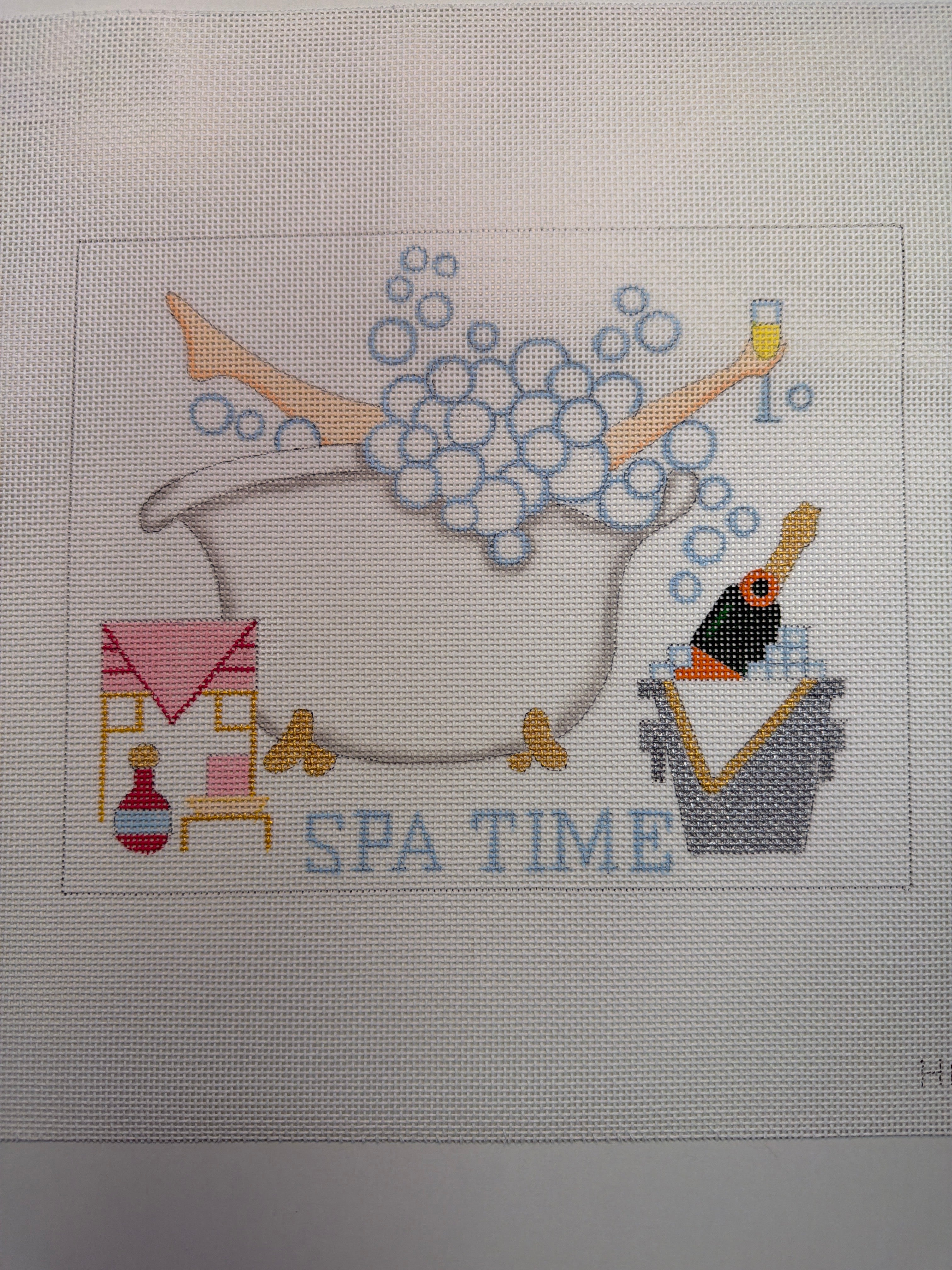 Bath time spa scene embroidery: gray tub with bubbles, orange accents and small icons