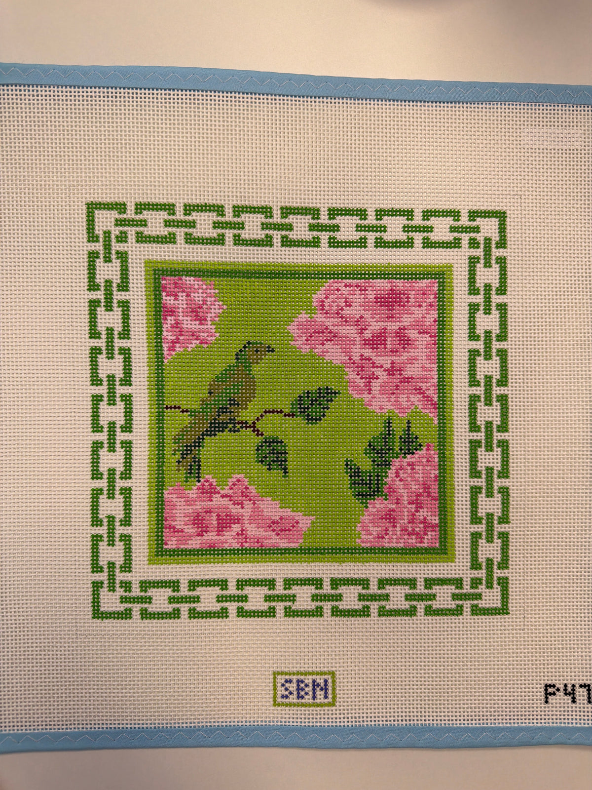 Beige embroidery canvas with green bird and pink peonies cross-stitch design
