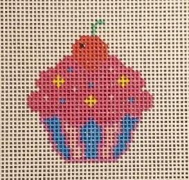 Cupcake needlepoint stitched motif with pink cupcake and blue base, green top