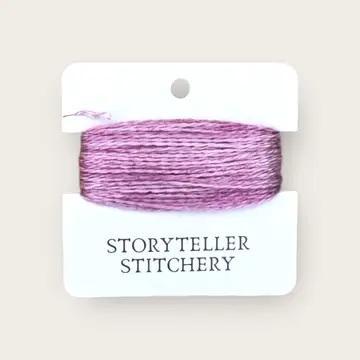 Hand-dyed embroidery thread spool, purple and lavender variegated.