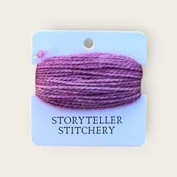 Hand-dyed embroidery thread spool in lavender purple on a card backing.