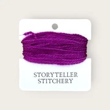 Hand-dyed embroidery thread on card, vivid purple-magenta skein with variegated strands
