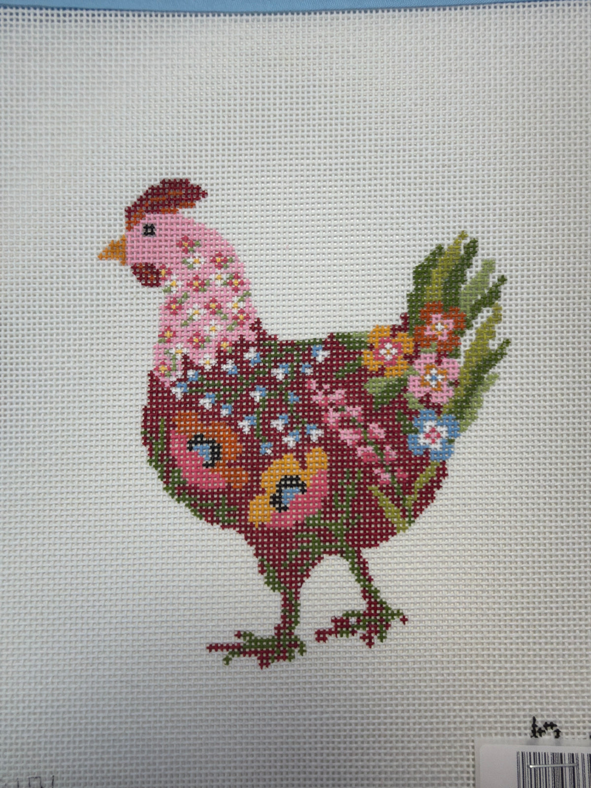 Colorful chicken needlework with detailed multicolor feathers and beak