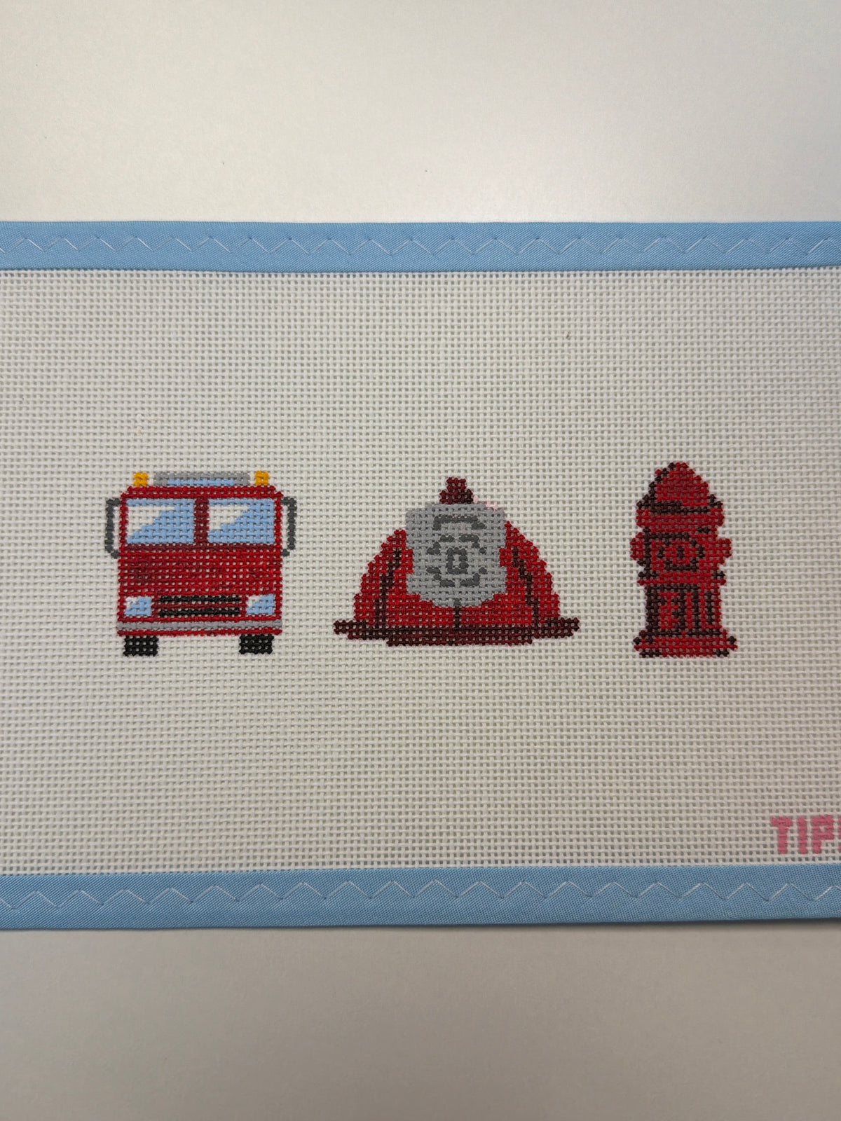 Firefighter-themed pixel art set: fire truck, firefighter, and fire hydrant