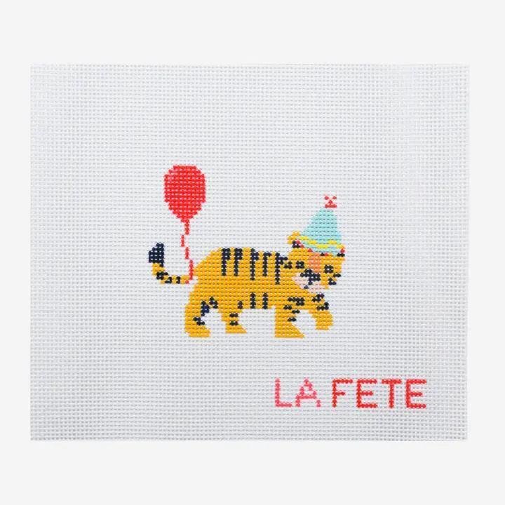 Square embroidered tiger-style animal patch with party hat, red balloon, and "LAFETE"