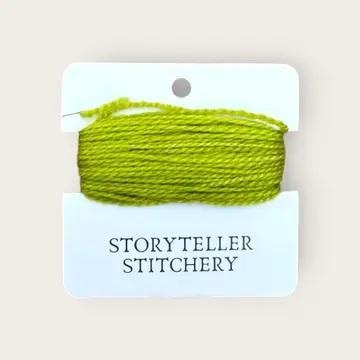 Hand-dyed embroidery thread spool, bright lime green, tightly wound