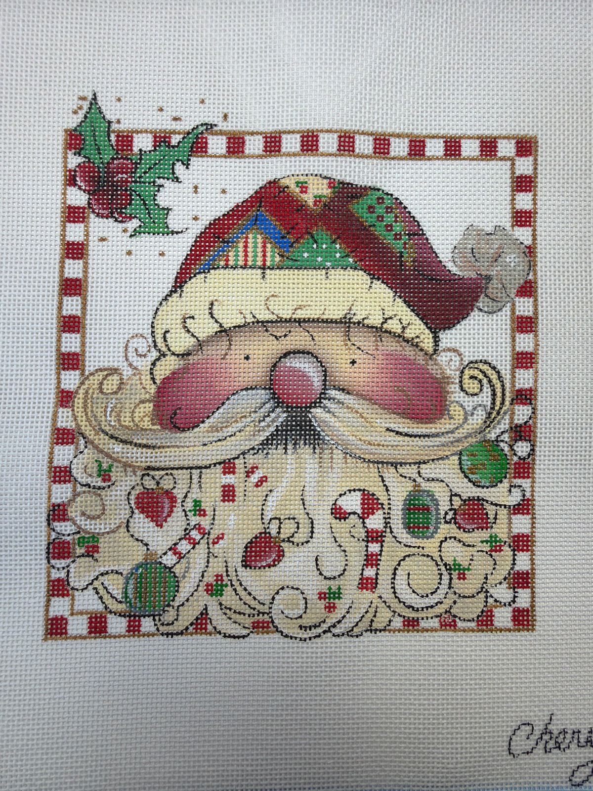 Embroidered Santa Claus face patch with red nose, green hat, and festive holiday accents