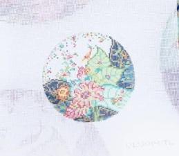 Round decorative plate with colorful floral world map design