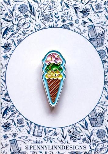 Ice cream cone needle minder pin with multicolor enamel on a white background