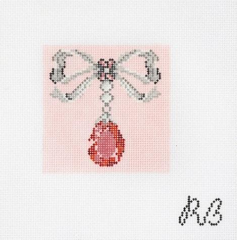 Pink bow with dangling red teardrop gemstone, beaded on light fabric backing