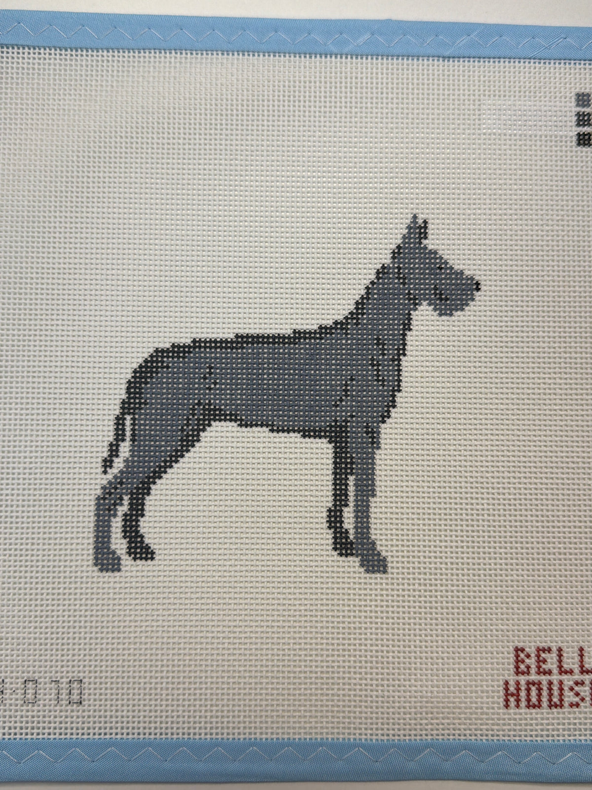 Embroidered dark gray dog standing in side view
