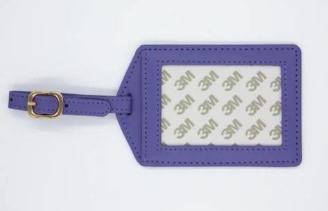 Lavender leather luggage tag with metal clasp ring and stitched front panel