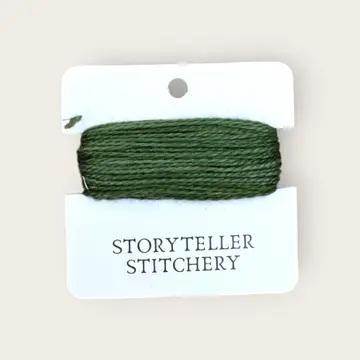 Hand-dyed embroidery thread spool, dark green, tightly wound