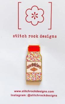 Stitch Rock needle minder: colorful milk carton charm with orange cap on card