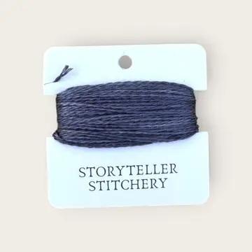 Hand-dyed embroidery thread spool, dark navy blue solid tone.