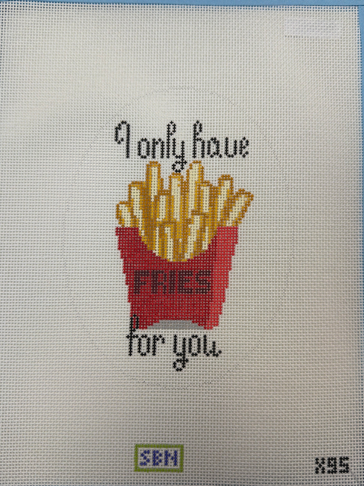 Beige fabric panel with fries graphic and motivational quote text