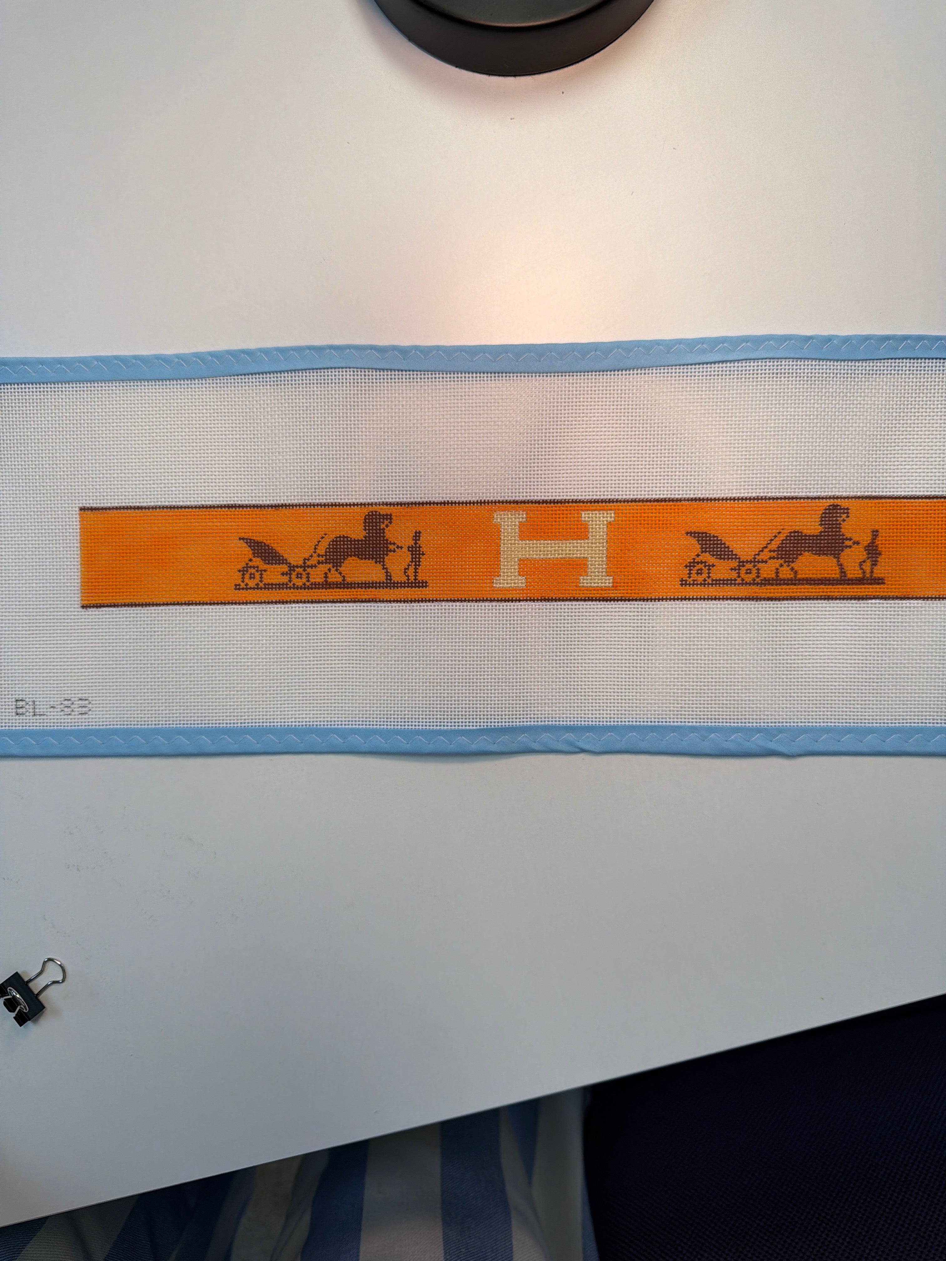 Hermes belt strap with orange leather and H logo, horse motif