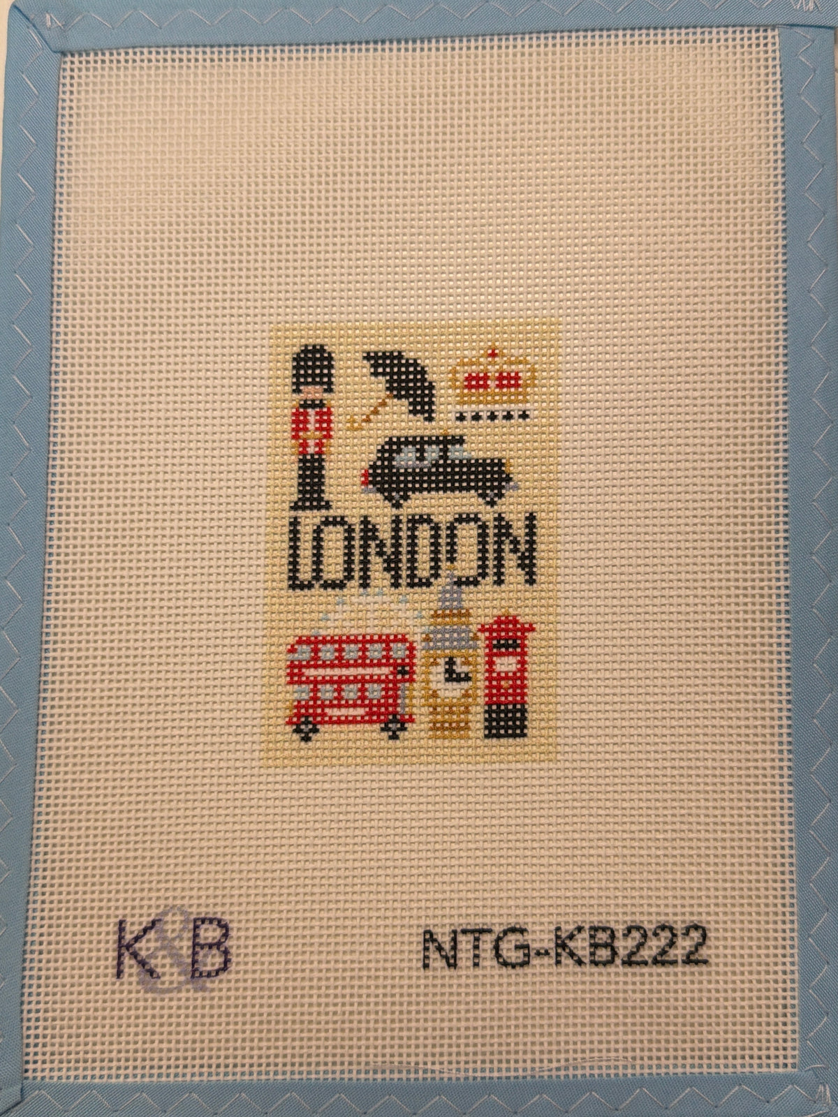 Beige travel tag with pixel art London theme and printed codes KB, NTG-XB222