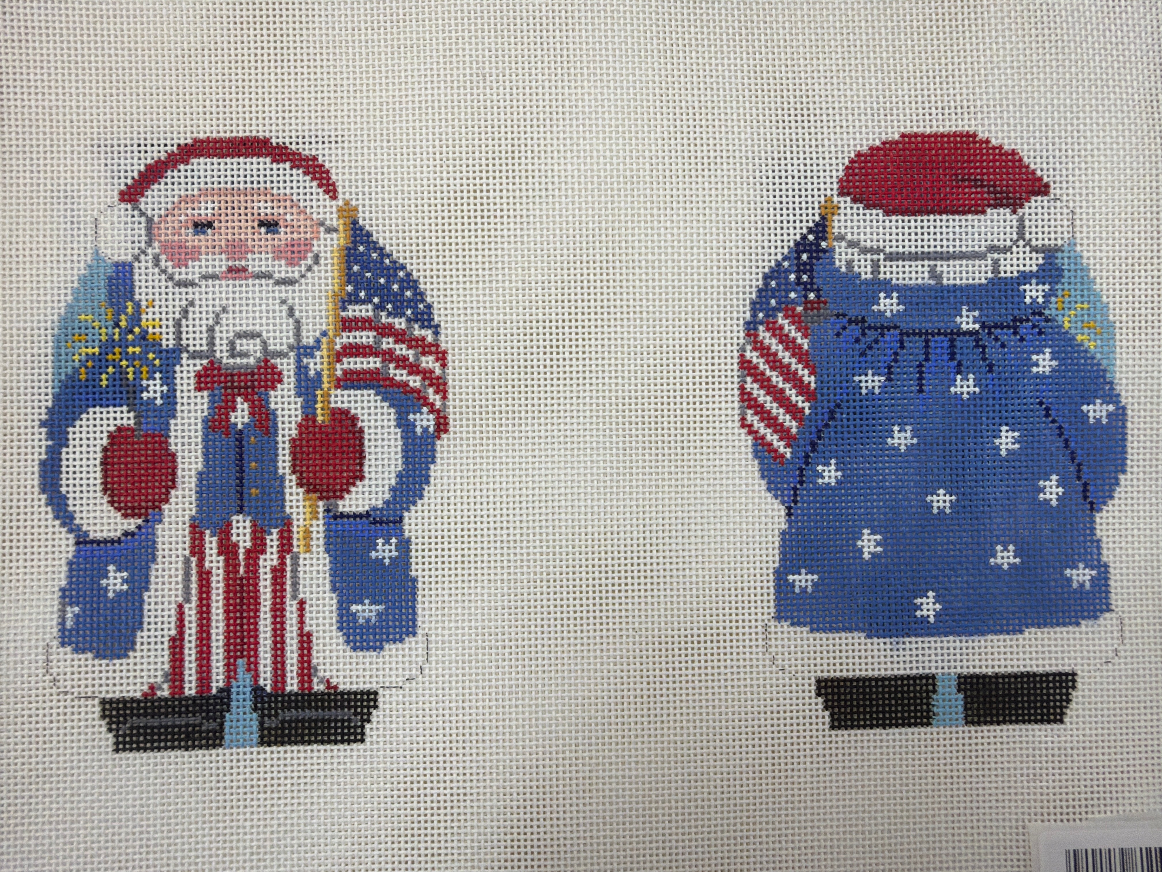 Blue knit Santa-themed sweater with stars and stripes graphic