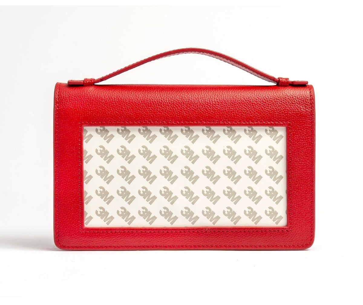 Red leather clutch with top handle and rectangular front window lining