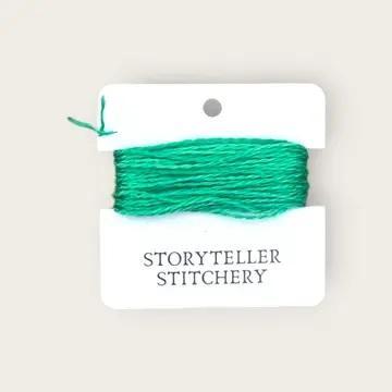 Hand-dyed embroidery thread spool, vivid green variegated.