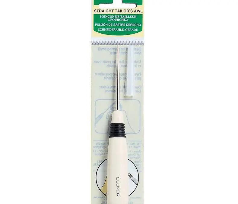 White-handled straight tailor's awl with metal pointed tip and black grip