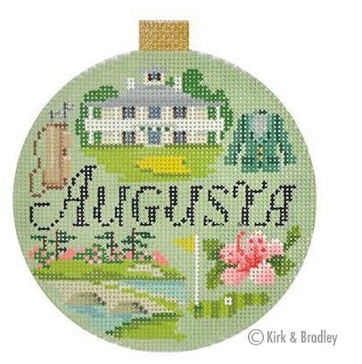 Round needlepoint ornament with Augusta cross-stitch scene, green frame, floral accents