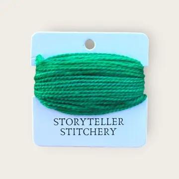 Hand-dyed yarn thread spool, vivid green on a hanging card
