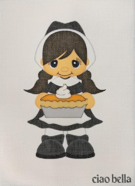 Pilgrim girl decoration holding a pie, wearing a black dress and white bonnet