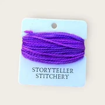 Hand-dyed yarn thread spool, bright purple on a hanging card