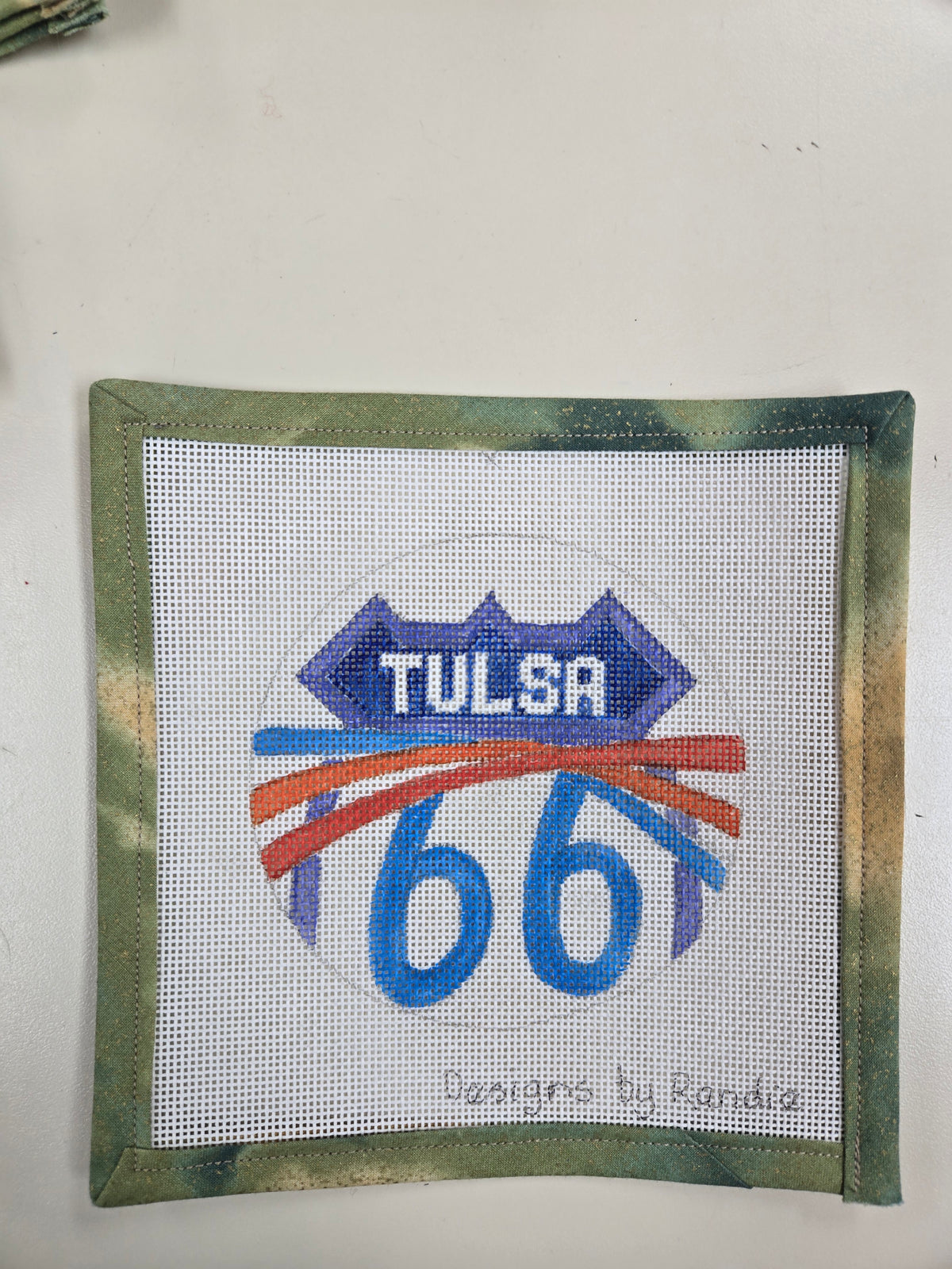 Tulsa 66 needlepoint square with a highway shield design