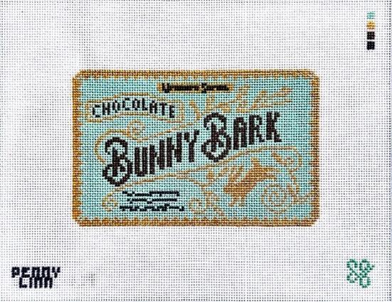 Rectangular printed label reading Bunny Bark with blue text and light graphics