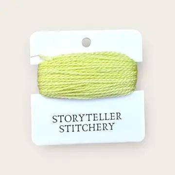 Hand-dyed embroidery thread spool, chartreuse green variegated.