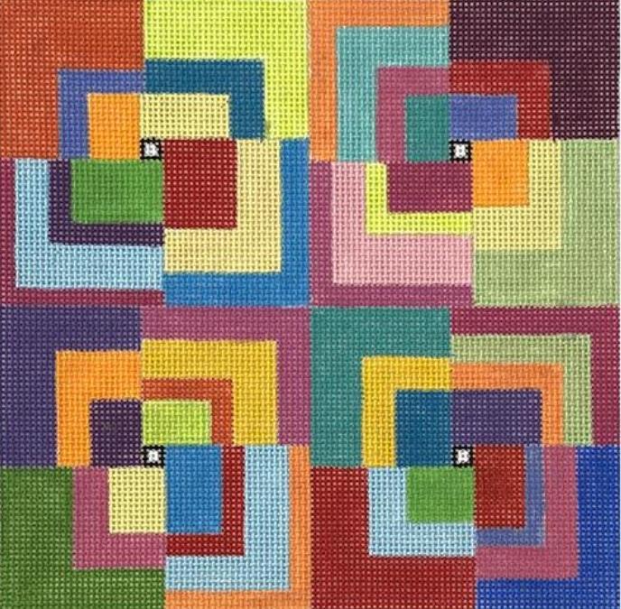 Colorful patchwork fabric with geometric squares and multicolor blocks