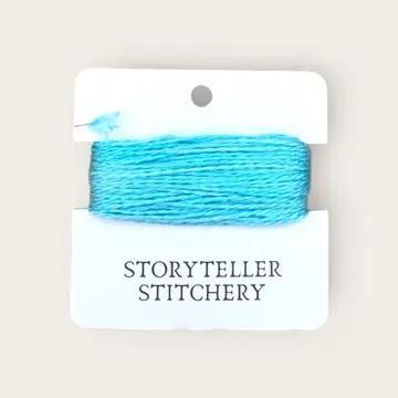 Hand-dyed embroidery thread spool, bright aqua blue variegated.
