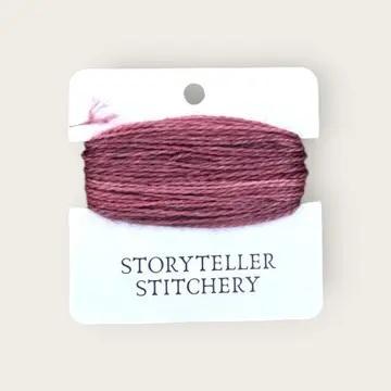 Hand-dyed embroidery thread spool, dusty rose and maroon variegated.