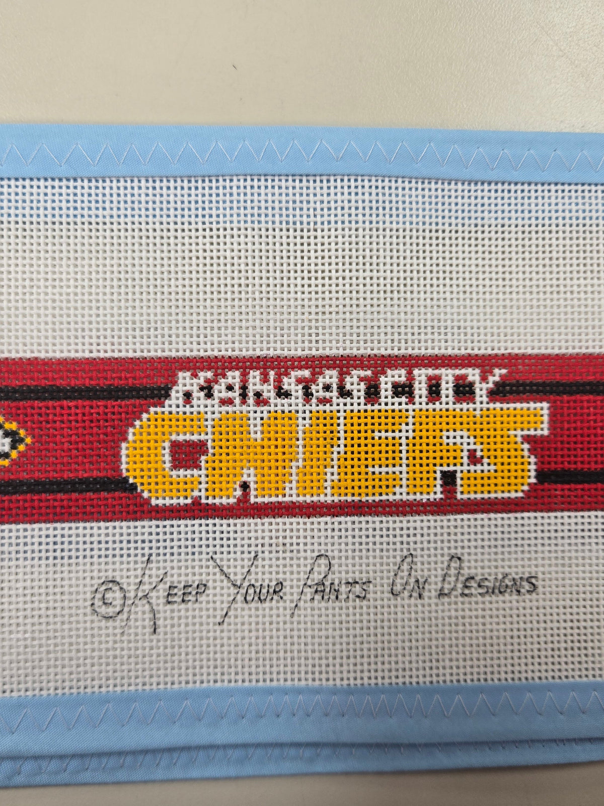 Kansas City Chiefs fabric belt with red, black, and white woven logo graphic