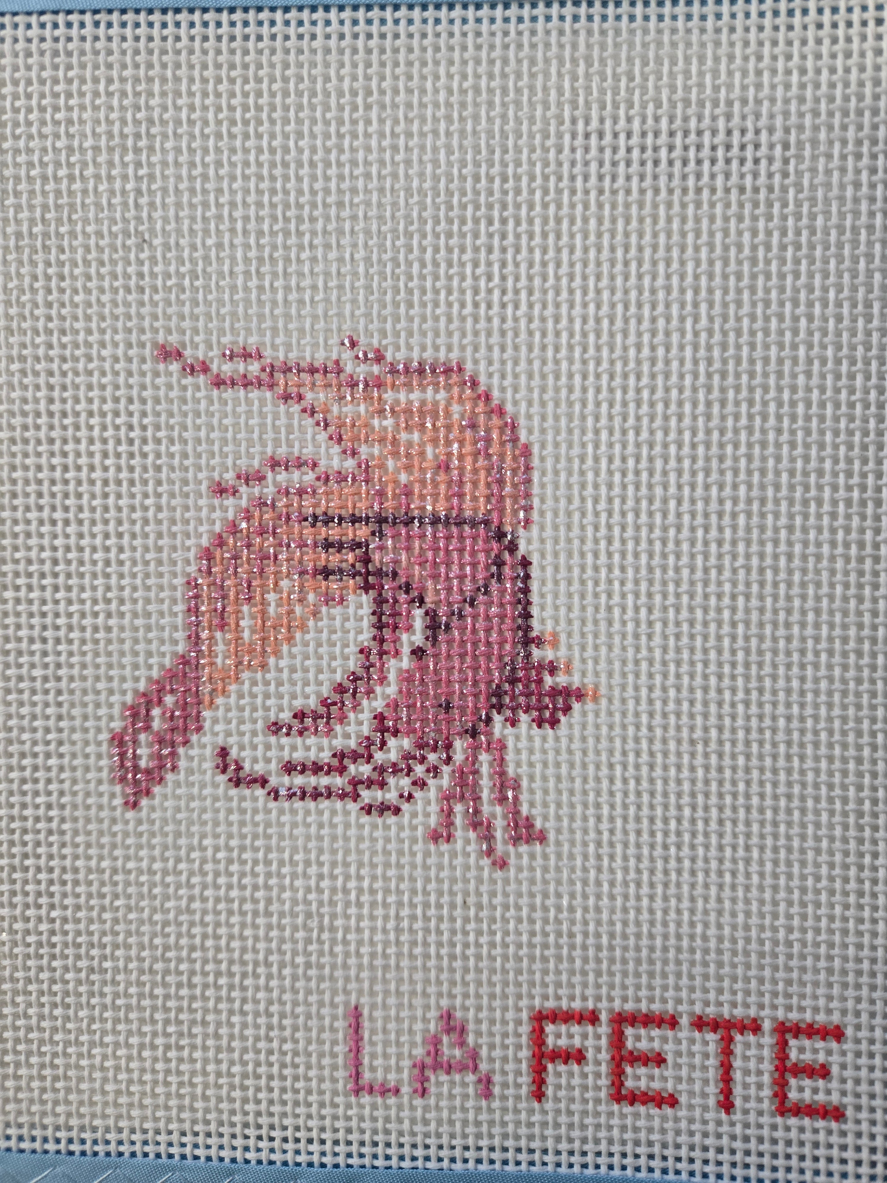 Embroidered glitter fish with "LA PETITE" text, multicolor thread