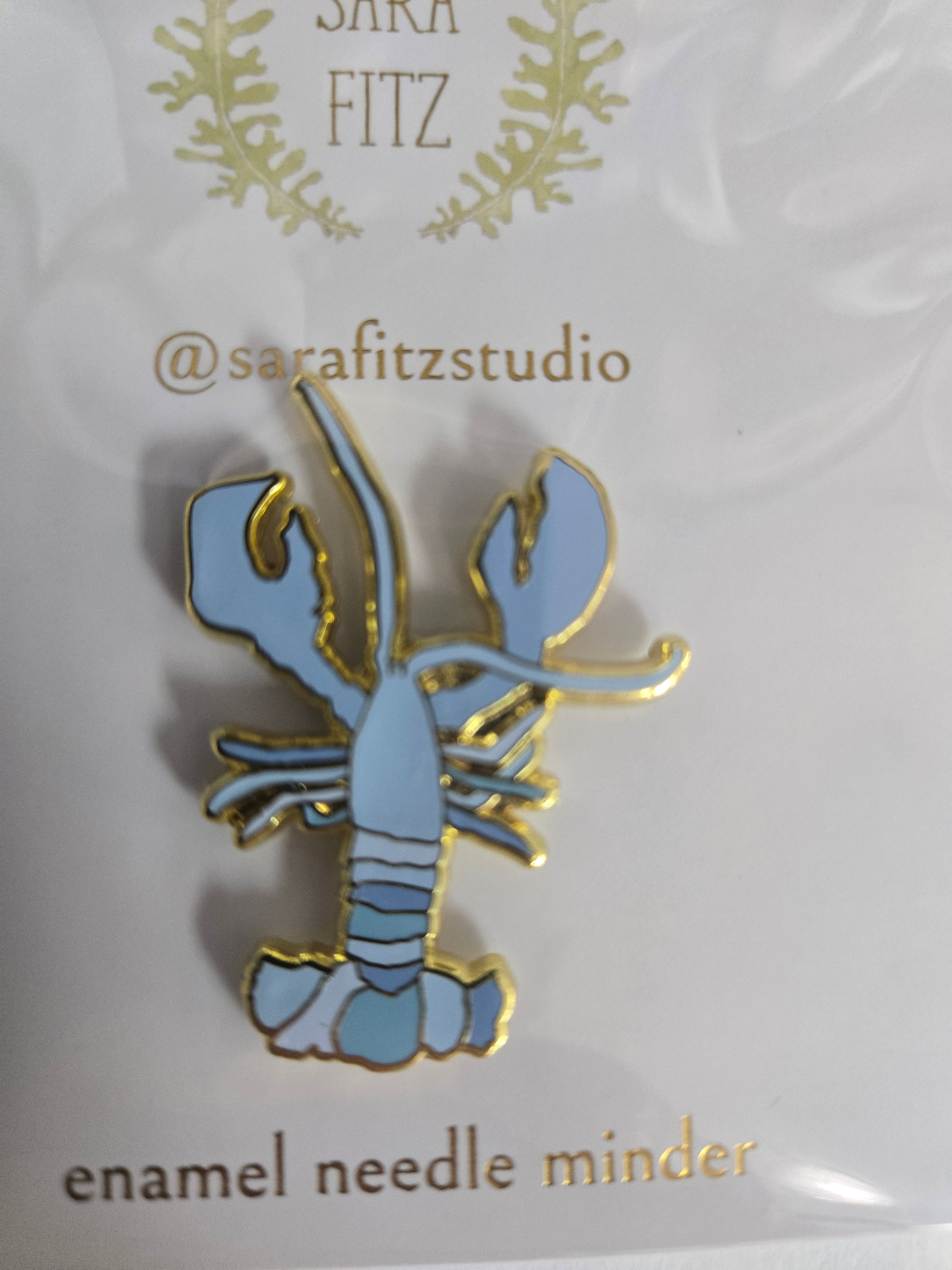 Blue enamel lobster needle minder with gold accents